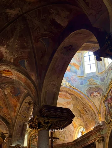 Decorated arches and painted vaults inside a church