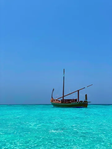 Traditional boat on vivid turquoise water