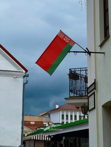 Belarusian flag hanging above a narrow street